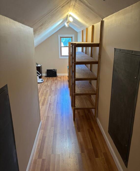 Wooden shelving installed on wall in Hampton, NH