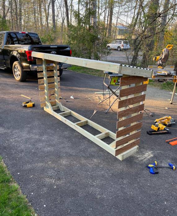 Wooden firewood storage structure built by Anchor Point Repair in Hampton, NH