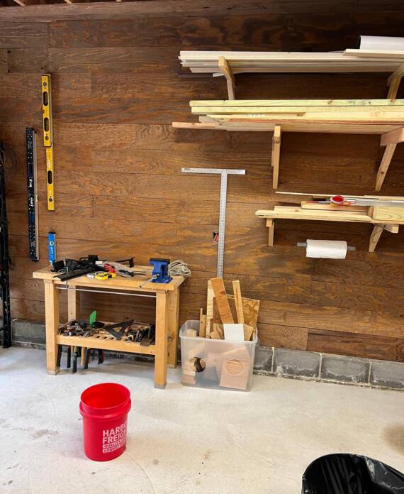 Handyman installing wall shelves in Hampton, NH