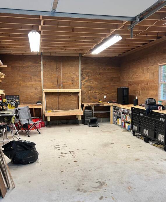 Handyman installing wall shelves in Hampton, NH