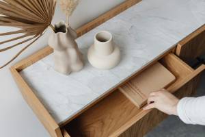 Handyman repairing cabinet and drawer in Hampton, NH