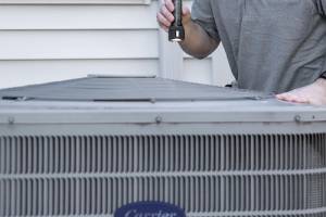 Handyman replacing home air filter in Hampton, NH