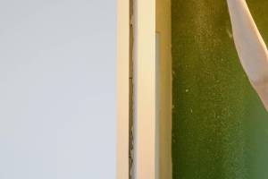Handyman repairing interior door and trim in Hampton, NH