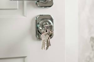 Handyman installing new door lockset in Hampton, NH
