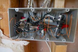 Handyman performing minor electrical repair in Hampton, NH